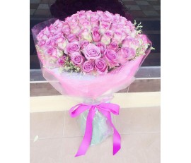 F9 99 PCS PURPLE ROSES BOUQUET WRAPPED ROUND IN PINK WRAPPING PAPER 